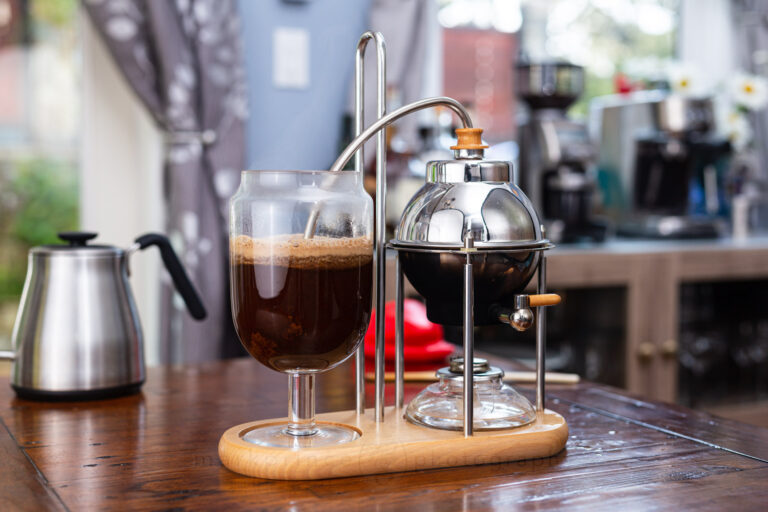 siphon coffee maker with fresh espresso in glass coffee pot on