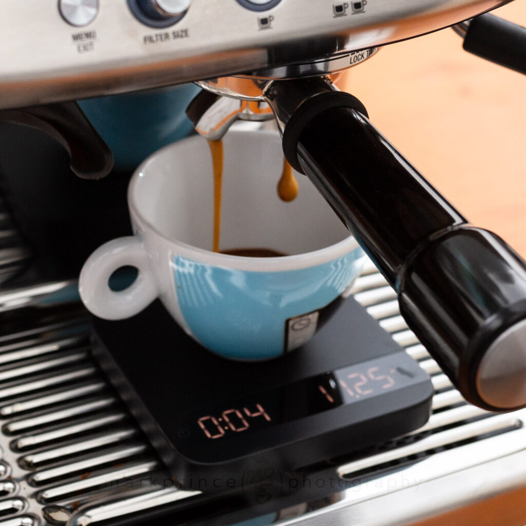 An espresso lungo being brewed on a Breville espresso machine.