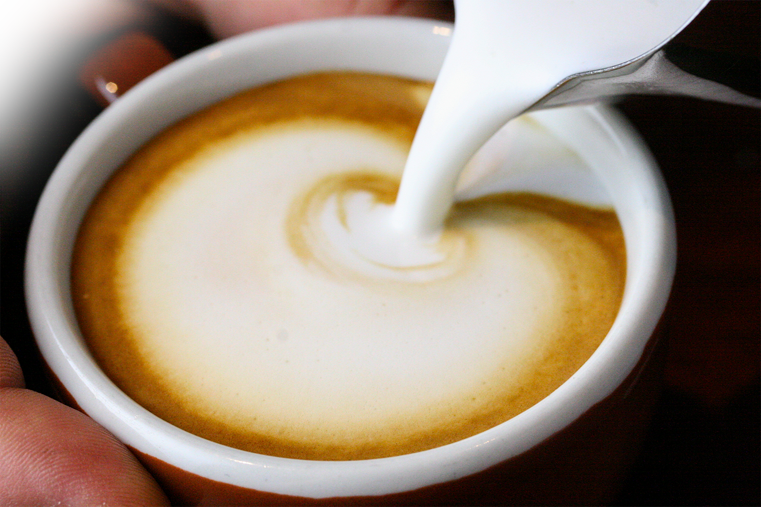 How can baristas foam milk for specialty coffee without using