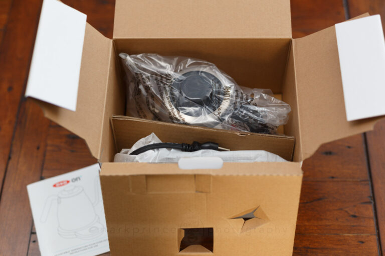 The typical look inside these boxes - cardboard dividers, plastic wrap, soft protective fabric wrap for the base.