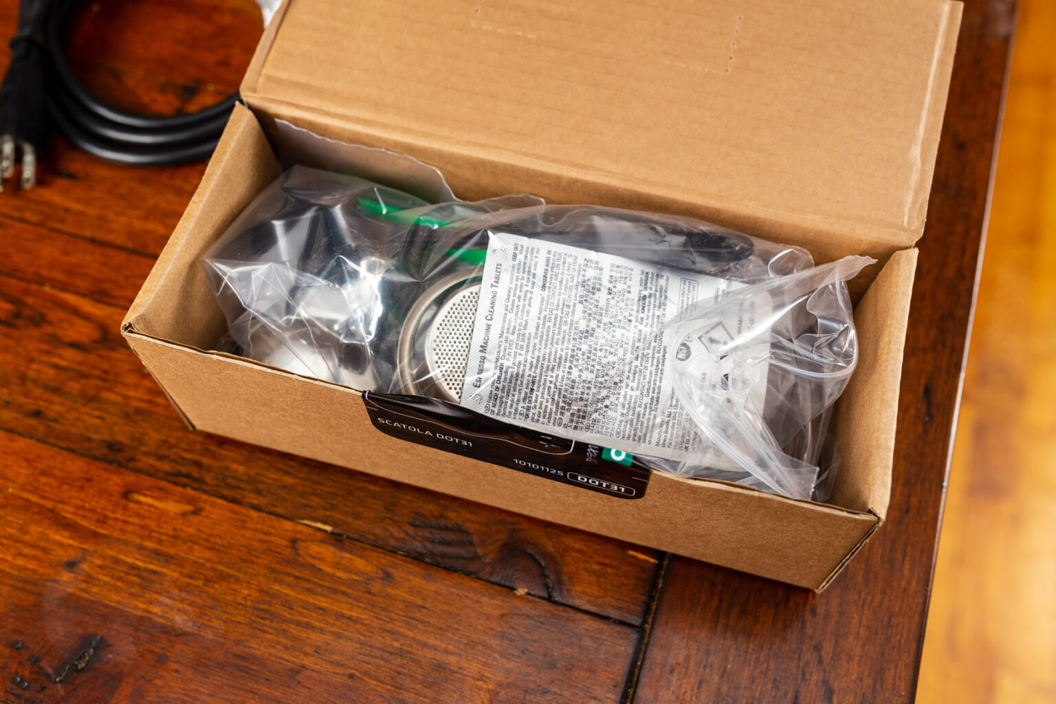The box containing all the extras that Rancilio includes with the machine, as well as the basics.