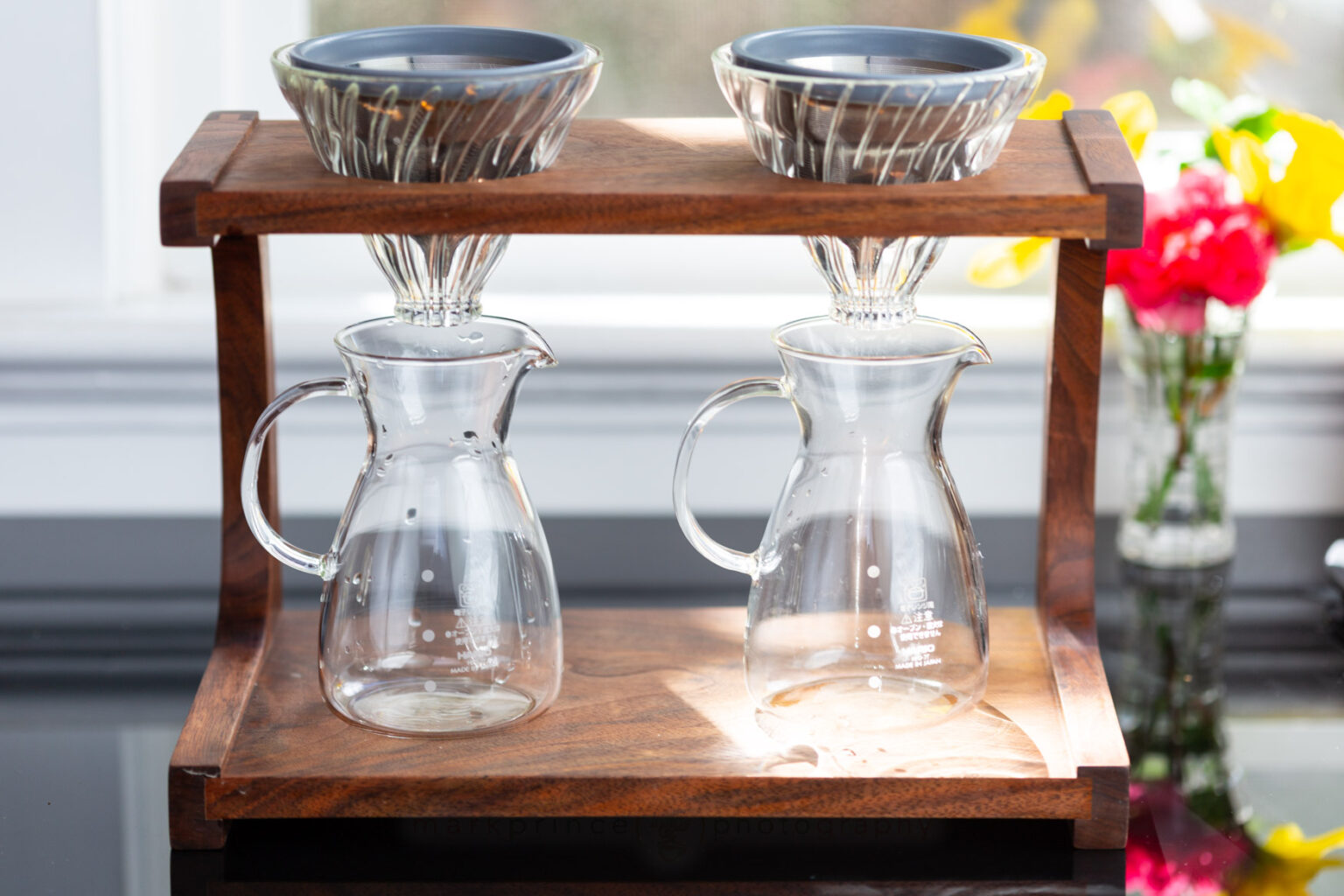 A custom two-brewer brewing stand made by Clive Coffee, works well with the Kone Minis.