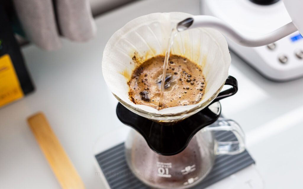 Fresh coffee, with hot water poured on it, releases a lot of C02, called the "bloom"