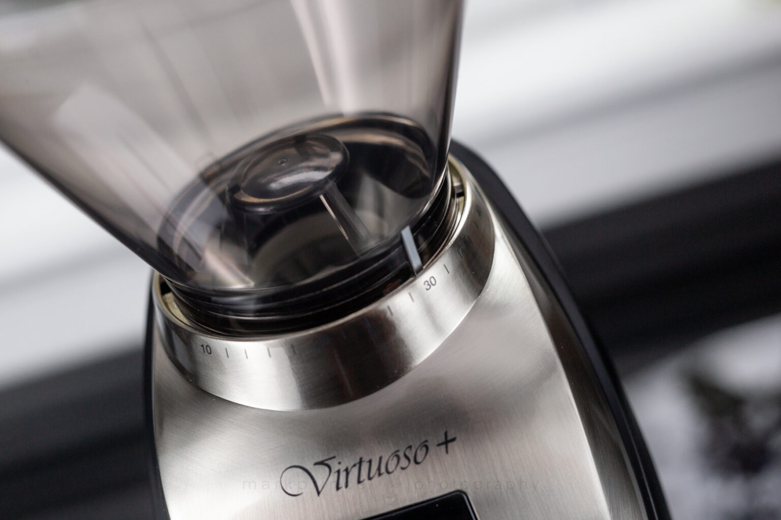 The grind is adjusted finer or coarser via the Virtuoso+'s collar. It has 40 settings.