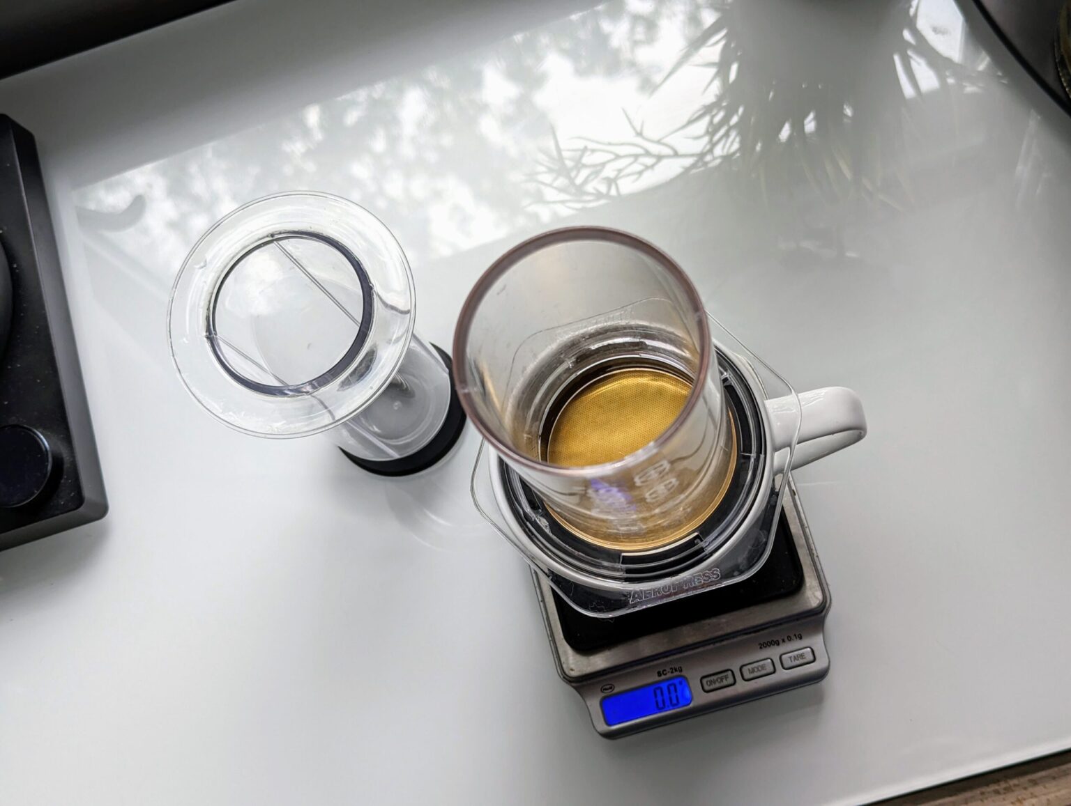 The Aeropress Clear, using a long-discontinued Able DISK gold plated filter disk.