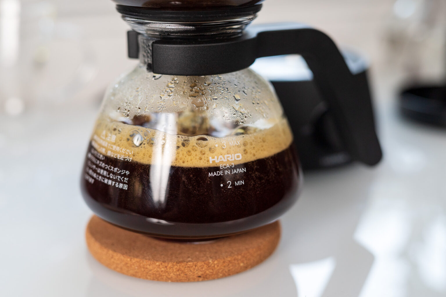 You know the brewing is complete on a siphon when air is drawn through the spent coffee, foam and agitating the finished brew.