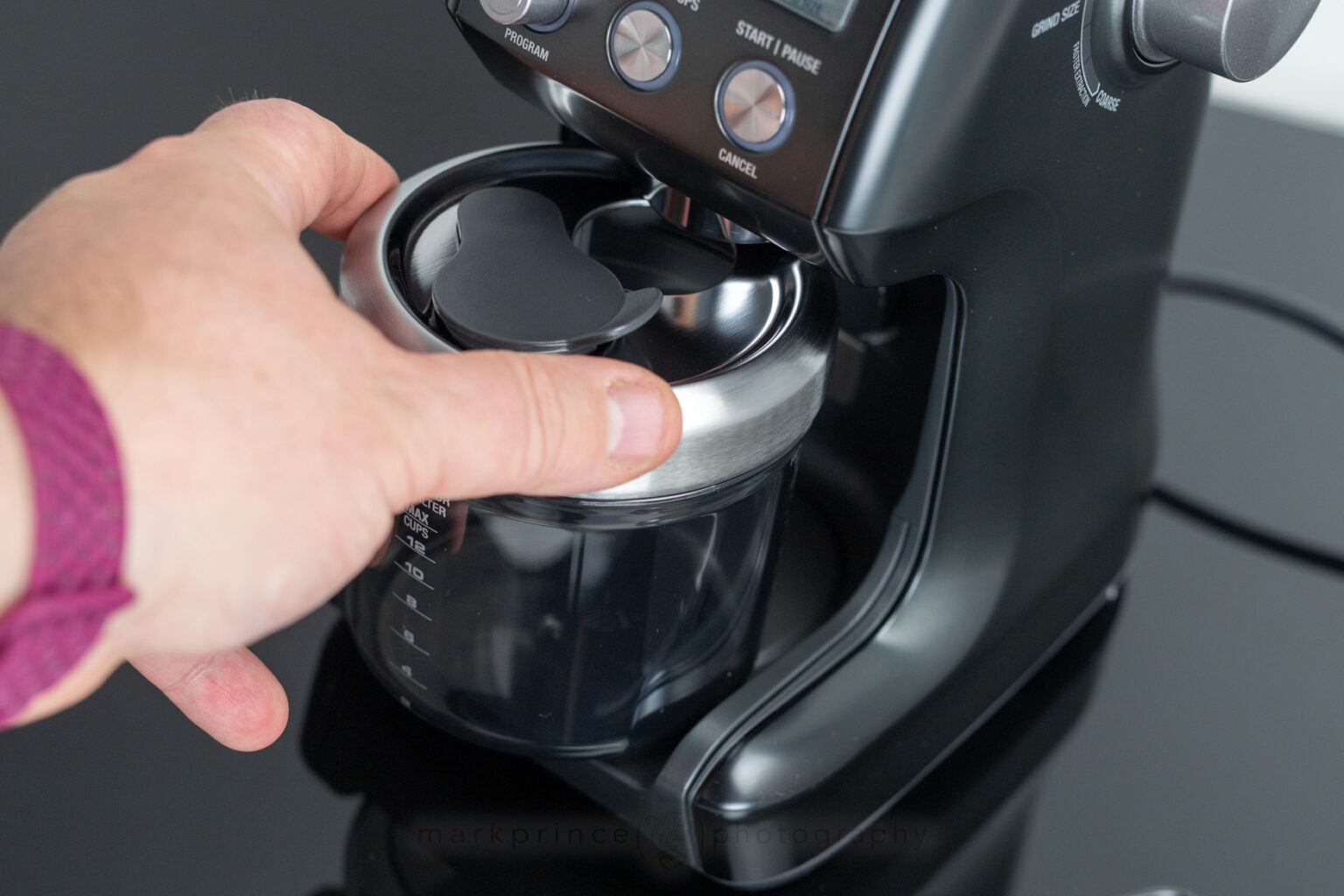 The grinds bin slots nicely under the grind spout thanks in part to a back-magnet that pulls it into the final place.