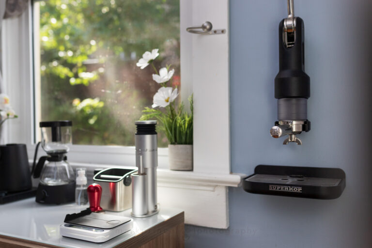 A brewing station at home with a wall mounted espresso machine.