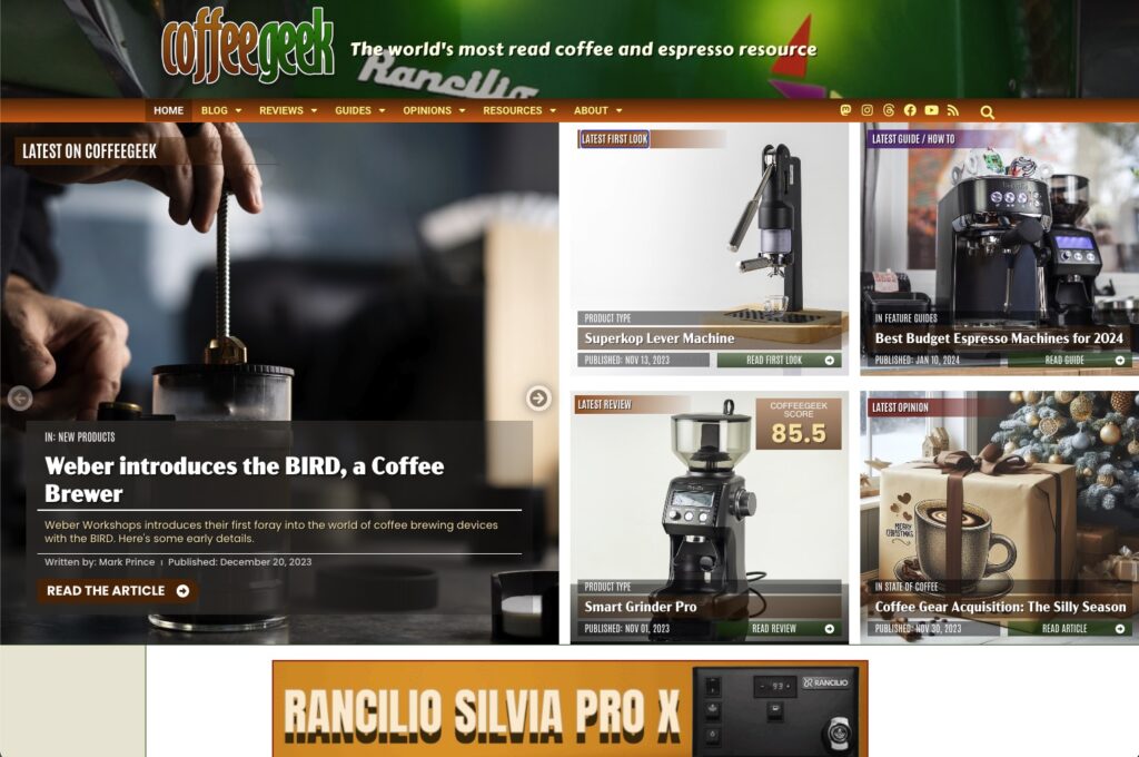 New front page of the CoffeeGeek website, showing five areas of content: a slider with 5 recent articles on left, then four image boxes showing latest first look, review, guide / how to, and opinion article.