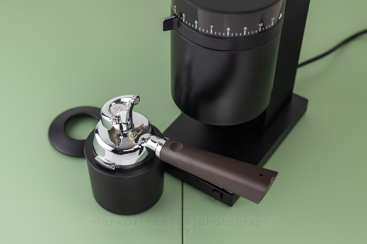 The bin, showing how a commercial 58mm portafilter sits on top.