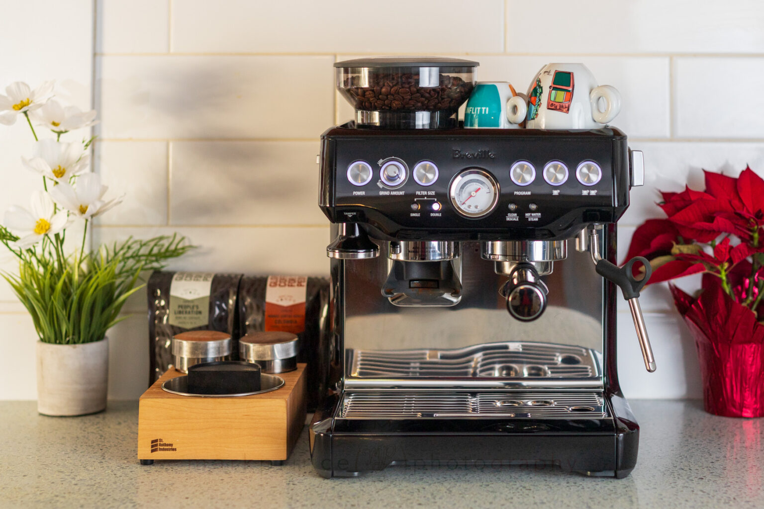 The Barista Express from Breville doesn't take up a lot of counter space, but provides both the grinder and espresso machine, as well as a hot water source.