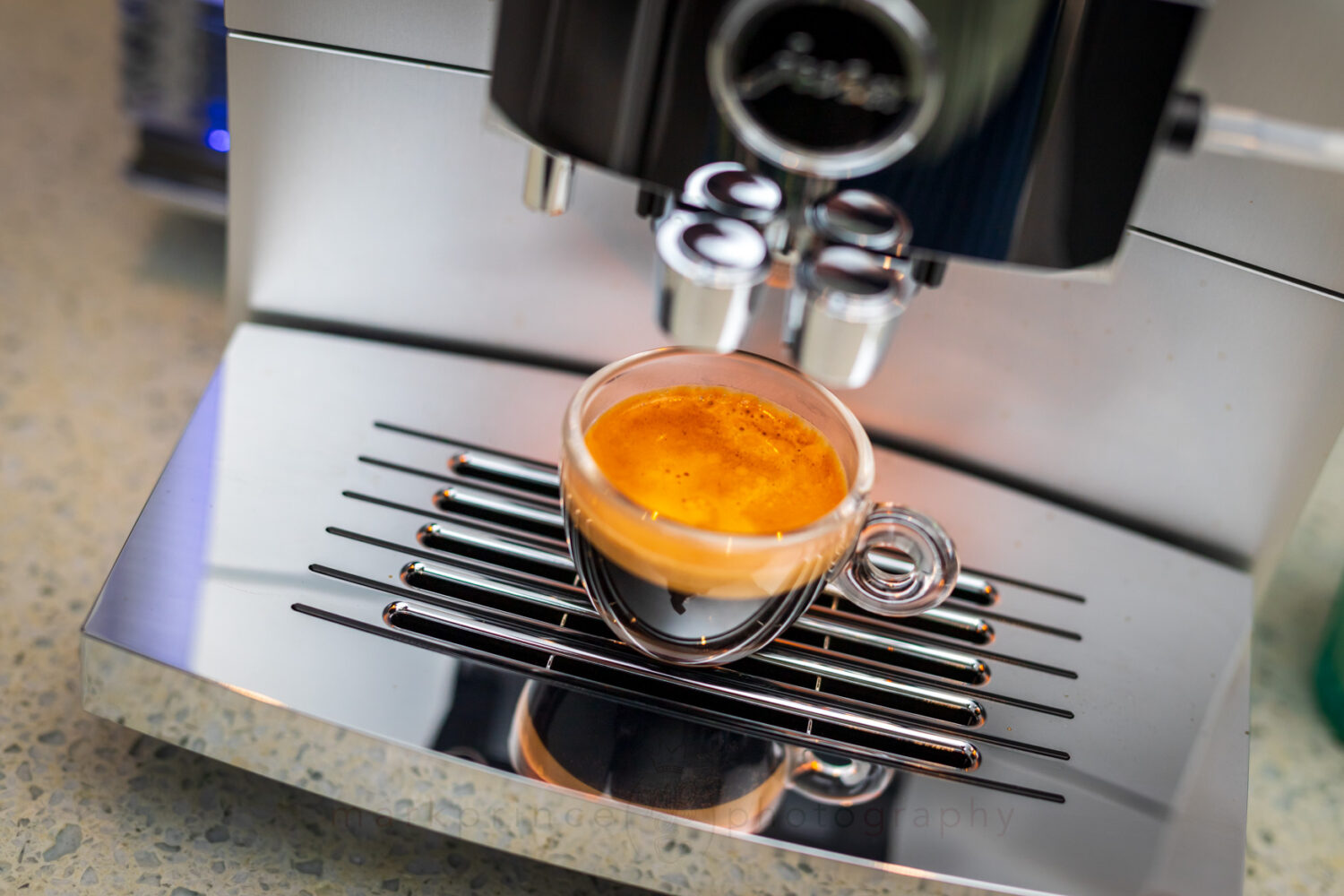 A shot of espresso brewed on a super automatic espresso machine