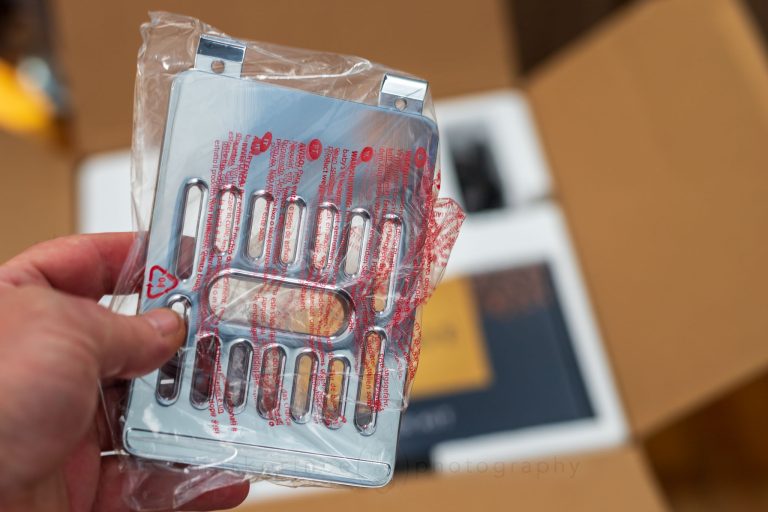 The elevated cup tray is very heavy and a chromed type of metal.