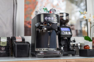 Breville Bambino Plus set up with all the tools needed to make great espresso.